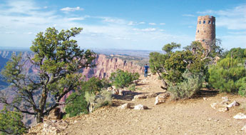 Mary Colter's 70-foot-tall watchtower rises over the Grand Canyon, offering visitors a panoramic view of the walls plummeting a couple of thousand feet below and a broad perspective of the Colorado River. Colter was an architect and interior designer who spent her entire career working for the Fred Harvey Company. Her tower is considered one of her finest works. &copy; 2011 Gallup Independent / Vida Volkert